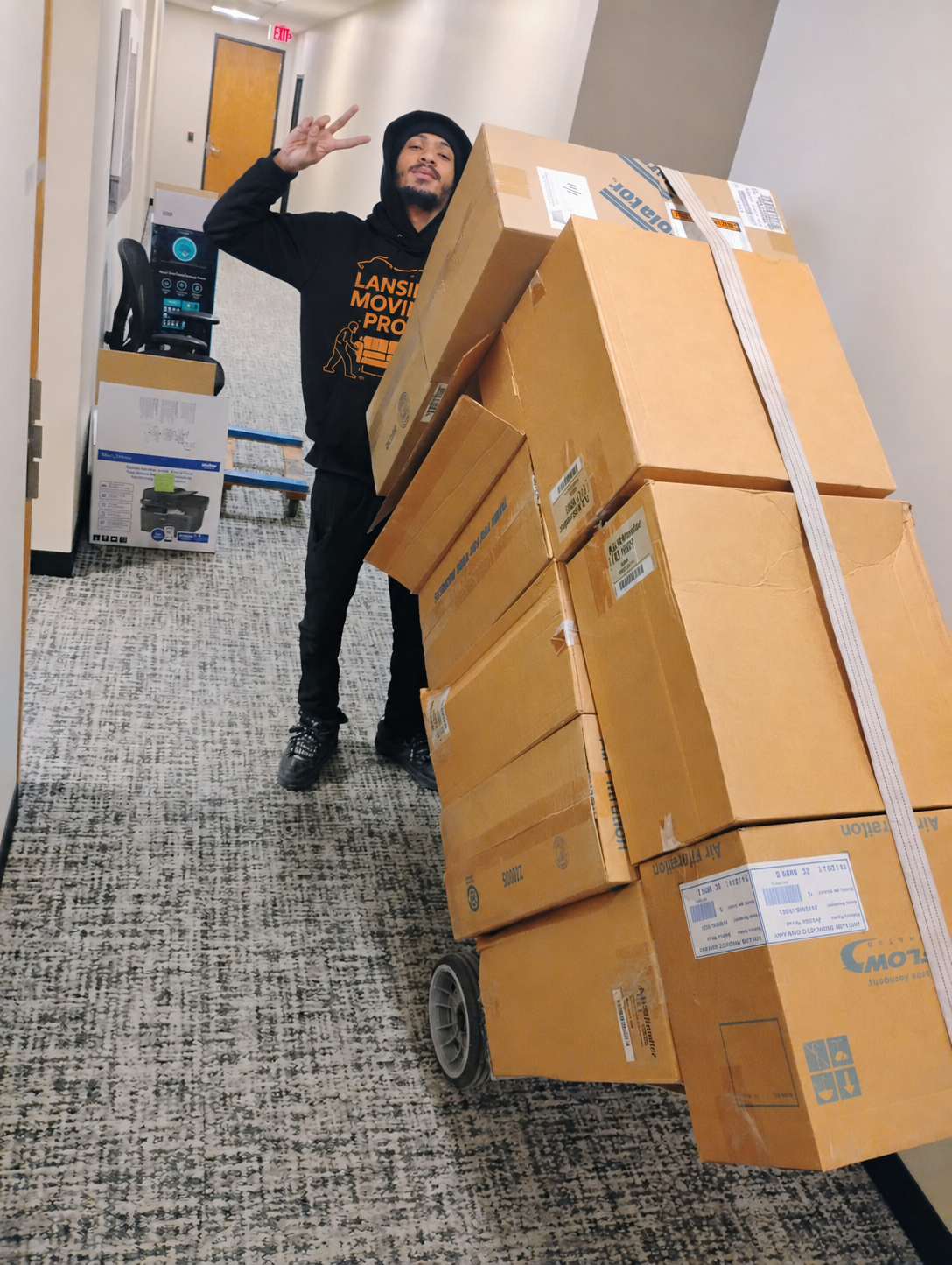 Lansing Moving Pros mover with dolly